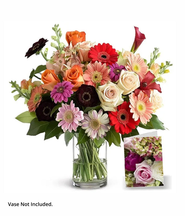 Florist's Choice III bouquet with colorful flowers in vase.