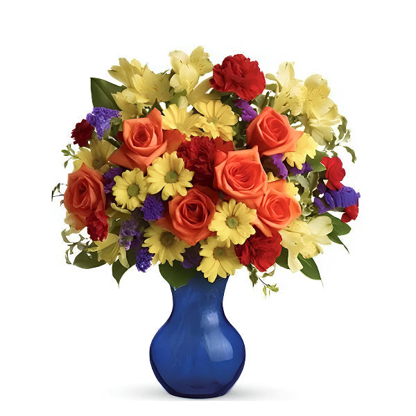 warm color flowers in a blue vase