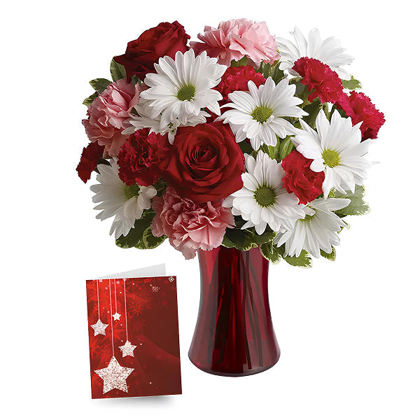 flowers in a red vase with a greeting card